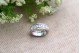 Anel em ouro branco com (7) diamantes em talhe brilhante com friso