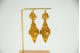 Par de brincos articulados em ouro amarelo em forma de bolotas como pingentes