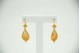 Brincos em ouro amarelo articulados ao estilo filigrana.