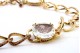 Colar em ouro de argolas com três quartzos lapidados e diamantes 