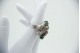 Conjunto em ouro branco de brincos e anel com esmeraldas e diamantes