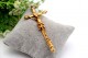 Crucifixo em ouro com Cristo revelado e aplicações na cruz