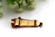 Corta cigarrilhas vintage em ouro com aplicações de rubis e argola de suspensão