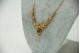 Gargantilha de ouro amarelo com diamantes (95) em talhe brilhante 8/8 e esmerald