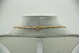 Gargantilha de ouro amarelo com diamantes (15) em talhe brilhante (15) 
