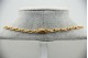 Gargantilha de ouro bicolor com elos articulados e diamantes (63) em talhe brilh