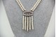 Gargantilha de ouro branco com pérolas e quatro fiadas, diamantes (14) em talhe 