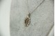 Medalha oval em ouro branco com diamantes (25) em talhe brilhante antigo