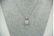 Medalha de ouro branco com diamantes (27) em talhe brilhante 8/8 e formato de co
