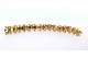 Pulseira em ouro de forma arliculada com lascas de diamantes e par bolas em cada