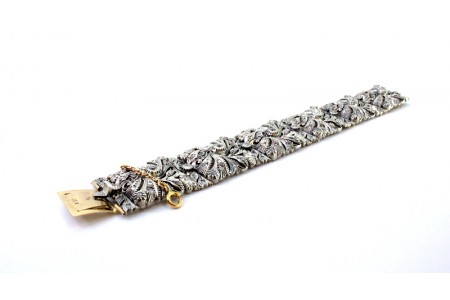 Pulseira em ouro e prata articulada com lascas e diamantes em talhe brilhante