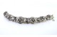Pulseira em ouro e prata articulada com seis diamantes em talhe brilhante