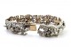 Pulseira em ouro e prata articulada com seis diamantes em talhe brilhante