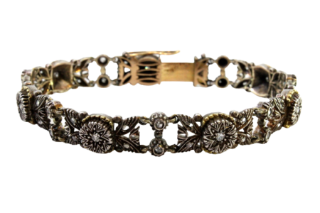 Pulseira em ouro e prata articulada com sete diamantes em talhe brilhante 