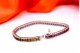 Pulseira em ouro branco com topázios calibrados coloridos e fecho de palheta.