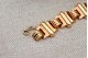 Pulseira em ouro de forma articulada com frisos em cada elo ao estilo Art Dêco