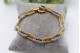 Pulseira em ouro bicolor com elos alternados e relevados.
