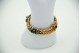 Pulseira em ouro amarelo com esmeraldas em formato cabochão e turquezas aplicada