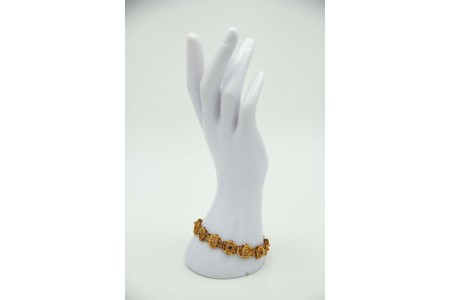 Pulseira articulada em ouro amarelo com elos filigranadas e aplicação de rosinha