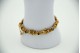 Pulseira articulada de ouro amarelo com rosinhas relevadas, lascas de diamantes