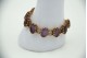 Pulseira de ouro amarelo poliarticulada com pedras roxas