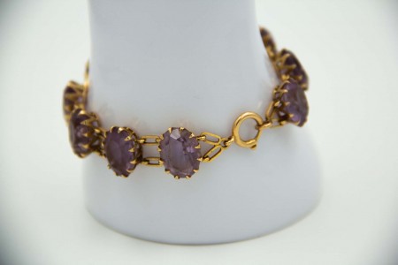 Pulseira de ouro amarelo poliarticulada com pedras roxas