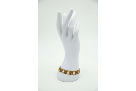 Pulseira de ouro amarelo de elos articulados comm figuras geométricas em esmalte