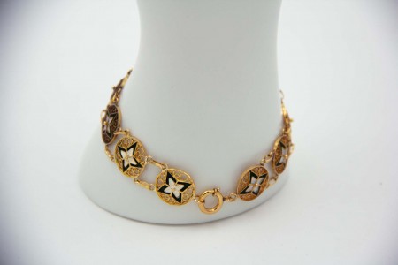 Pulseira articulada em ouro amarelo com figuras geométricas em esmalte