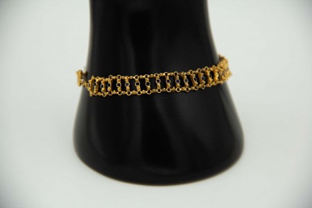 Pulseira articulada de ouro amarelo com relevos e aplicação de esmaltes 
