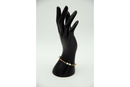 Pulseira articulada em ouro amarelo com oito pérolas e turquezas aplicadas.
