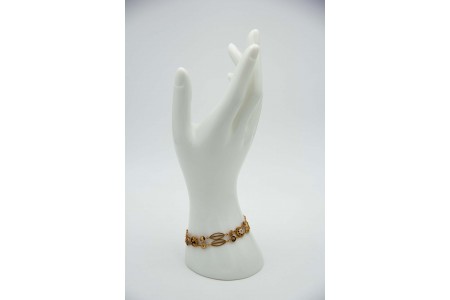 Pulseira articulada com caramujos, rosinhas em ouro amarelo e esmaltes