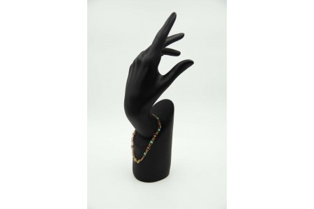 Pulseira em ouro amarelo com elos articulados e turquezas aplicadas.