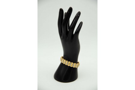 Pulseira oval em ouro bicolor em formato de mola e ao estilo escrava
