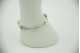 Pulseira de ouro branco com três pérolas e diamantes