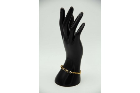 Pulseira de ouro amarelo com quatro pedras negras e diamantes