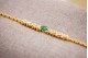  Pulseira de ouro com corpo central em formato espinhado, esmeralda lapidada e diamantes (40) em talhe brilhante 8/8.