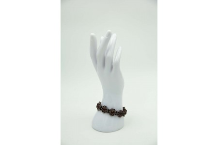 Pulseira de ouro e prata com elos articulados, rubis em talhe cabochão e lascas