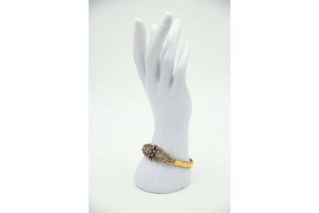 Pulseira de ouro e prata com diamante aplicado no centro em forma de flor e lasc