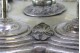 Conjunto de seis cálices em prata lisa assentes sobre base frisada e seis pés esféricos.