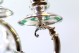  Candelabros em prata de dois lumes com hastes frisadas ao alto sobre folhas 