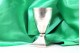 Taça em prata com gravados, brasão, e base quadrada.