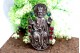 Moldura em prata com figura religiosa e pedras coloridas incrustadas