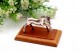 Miniatura de cavalo em prata assente em base de madeira