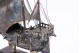  Caravela portuguesa em prata profusamente definida e assente em base de madeira.