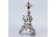 Paliteiro em prata com cisnes no plinto e sobre flor de acanto em base tripode recortada. 