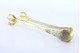  Pinça para gelo em prata em forma de garras de ave em dourado.