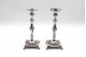  Castiçais em prata com fustes torneados, arandelas guilhochadas