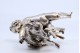 Figura de Putti com animal em prata. 